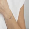 GEORG JENSEN ARMBÅND OFFSPRING SØLV OG GULL